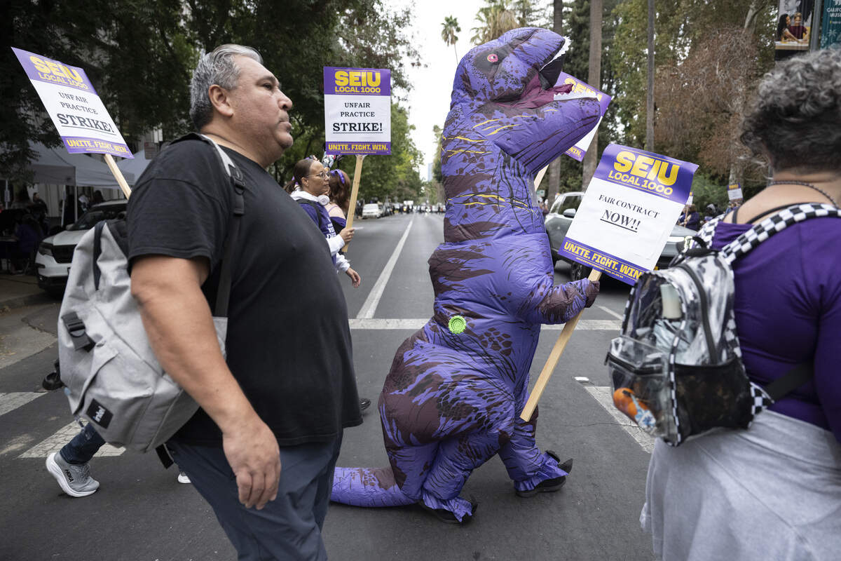 SEIU 1000 members strike outside the California Department of Education Headquarters in Sacramento on Wednesday, Oct. 21, 2026.